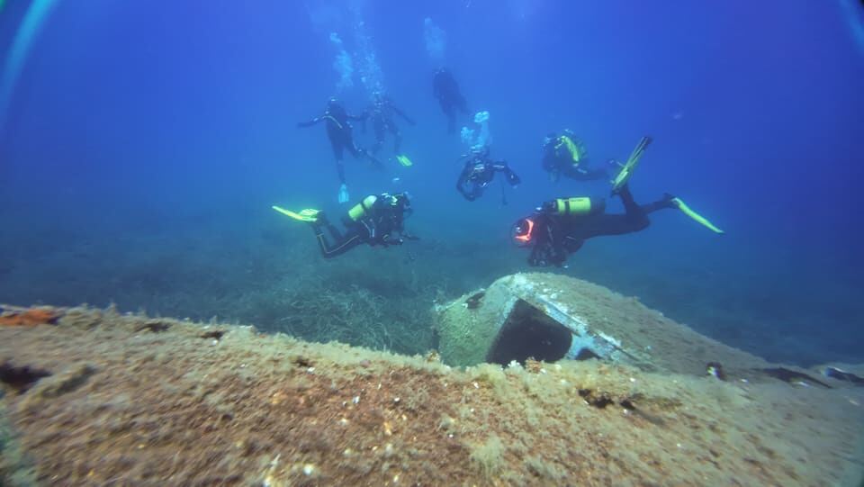 Divers above a wreck